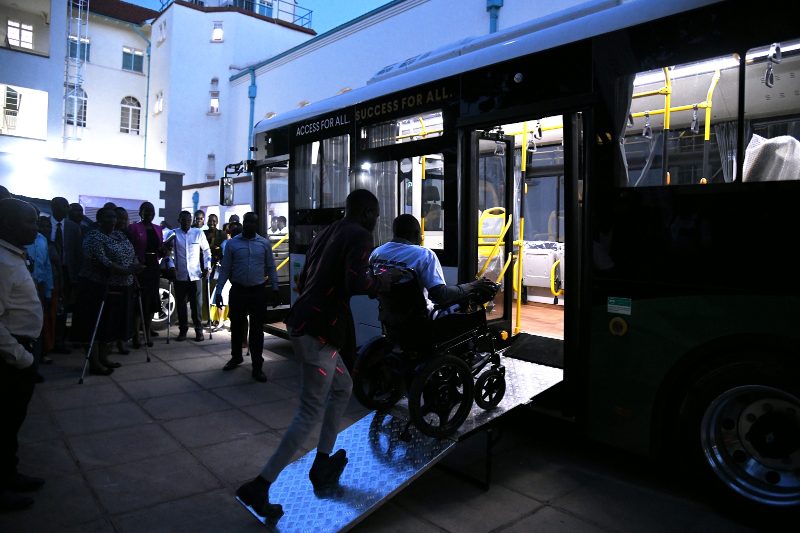 Hon. Asamo and officials at the official launch of the bus donated by Kiira Motors Corporation to ease mobility of students and staff with disabilities. Makerere University International Day of Persons with Disabilities Celebration, a moment dedicated to reflection on inclusion and shared responsibility organised by the Dean of Students and 91st Guild Ministry of Students with Disabilities, 1st December 2025, Main Hall, Kampala Uganda, East Africa.