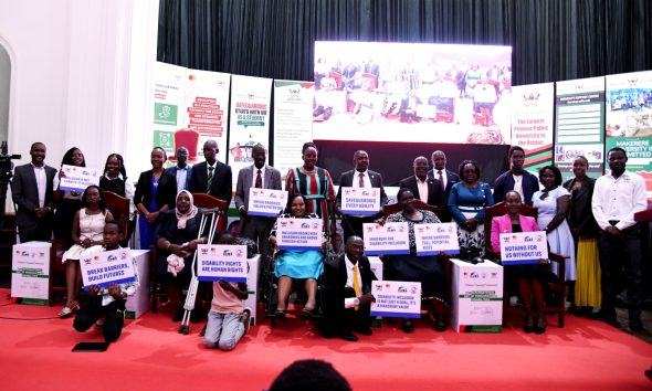Stakeholders pose for a group photo at the International Day of Persons With Disabilities celebration held in the Main Hall on 1st December 2025. Makerere University International Day of Persons with Disabilities Celebration, a moment dedicated to reflection on inclusion and shared responsibility organised by the Dean of Students and 91st Guild Ministry of Students with Disabilities, 1st December 2025, Main Hall, Kampala Uganda, East Africa.