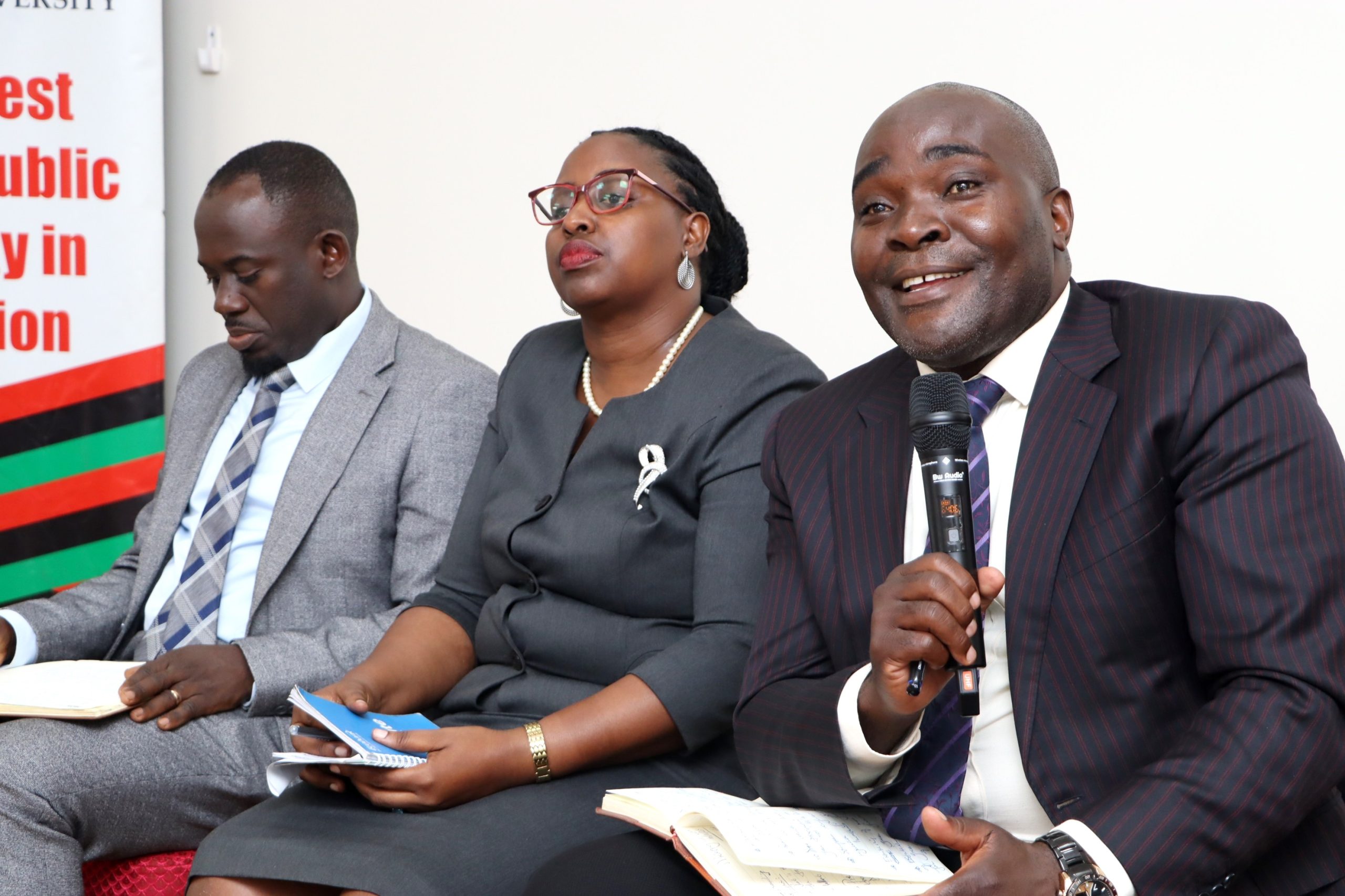Dr. John Sseruyange( R) giving his persepective. Makerere University high-level policy dialogue bringing together the Environment for Development (EfD-Mak) Centre, Green Gas + Reforestation + Offset (GRO)  and  Bank of Uganda, to explore alternative financing mechanisms for climate action and sustainable development, 3rd December 2025, Seminar Room 1, Main Building, Makerere University, Kampala Uganda, East Africa.