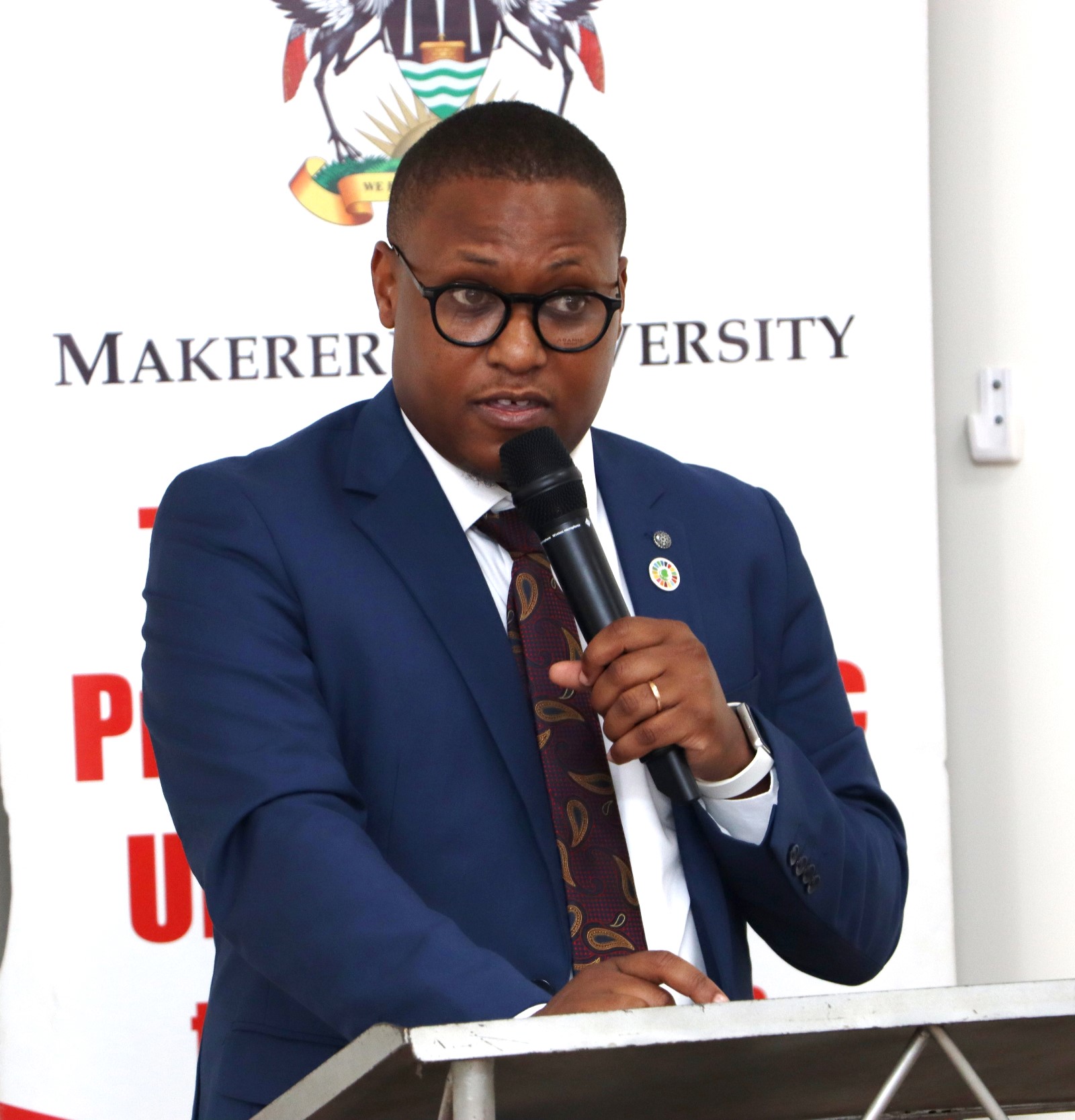Regional Director GRO Foundation Mr. Laban Joshua Musinguzi making his remarks. Makerere University high-level policy dialogue bringing together the Environment for Development (EfD-Mak) Centre, Green Gas + Reforestation + Offset (GRO)  and  Bank of Uganda, to explore alternative financing mechanisms for climate action and sustainable development, 3rd December 2025, Seminar Room 1, Main Building, Makerere University, Kampala Uganda, East Africa.