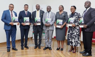 Panelists and some speakers posing for a photo with the GRO Annual report on 3rd December 2025. Makerere University high-level policy dialogue bringing together the Environment for Development (EfD-Mak) Centre, Green Gas + Reforestation + Offset (GRO)  and  Bank of Uganda, to explore alternative financing mechanisms for climate action and sustainable development, 3rd December 2025, Seminar Room 1, Main Building, Makerere University, Kampala Uganda, East Africa.
