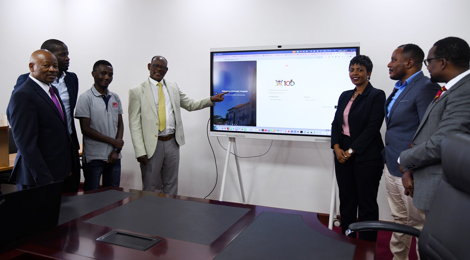 Prof. Barnabas Nawangwe (4th Left) flanked by Left to Right: Prof. Josaphat Byamugisha, Mr. Juma Katongole, Mr. Victor Watasa, Dr. Allen Kabagenyi, Mr. Samuel Mugabi and Prof. Bruce Kirenga launches the MakIHMIS. The Vice Chancellor, Prof. Barnabas Nawangwe (4th Left) and Chairperson, Dr. Allen Kabagenyi (4th Right) pose for a group photo at the Main Building Entrance with Mak-HUC Members and officials after the event. Makerere University Health User Committee (Mak-HUC)—established by the Vice Chancellor in 2022 as part of his strategic mandate to strengthen and oversee the University’s health service delivery-official handover of status report, 11th December 2025, Main Building, Kampala Uganda, East Africa.