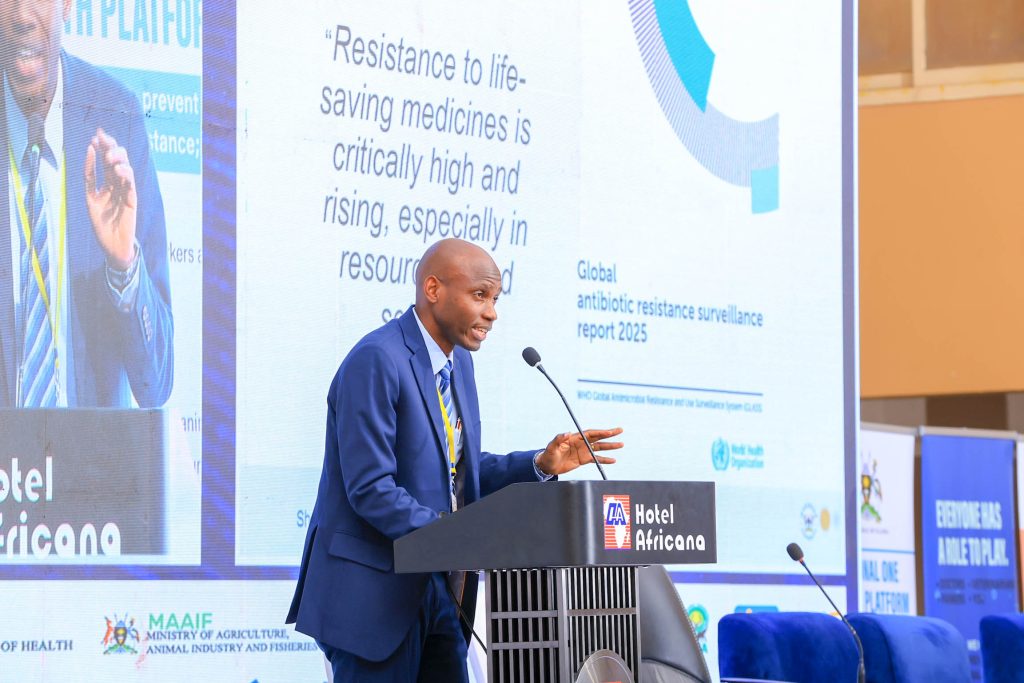 Assoc. Prof. David Musoke delivers the keynote address at the 10th National AMR Conference in Kampala on November 19, 2025, warning that Uganda’s fight against AMR will stall unless communities are placed at the centre of national action.