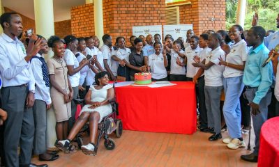 Dr. Rodney Rugyema (Centre) is joined by Staff and Student Safeguarding Champions to cut cake on 28th November 2025. Makerere University student and staff Safeguarding Champions celebration of Semester One achievements, 28th November 2025, Makerere Institute of Social Research (MISR) Gardens, Kampala Uganda, East Africa.