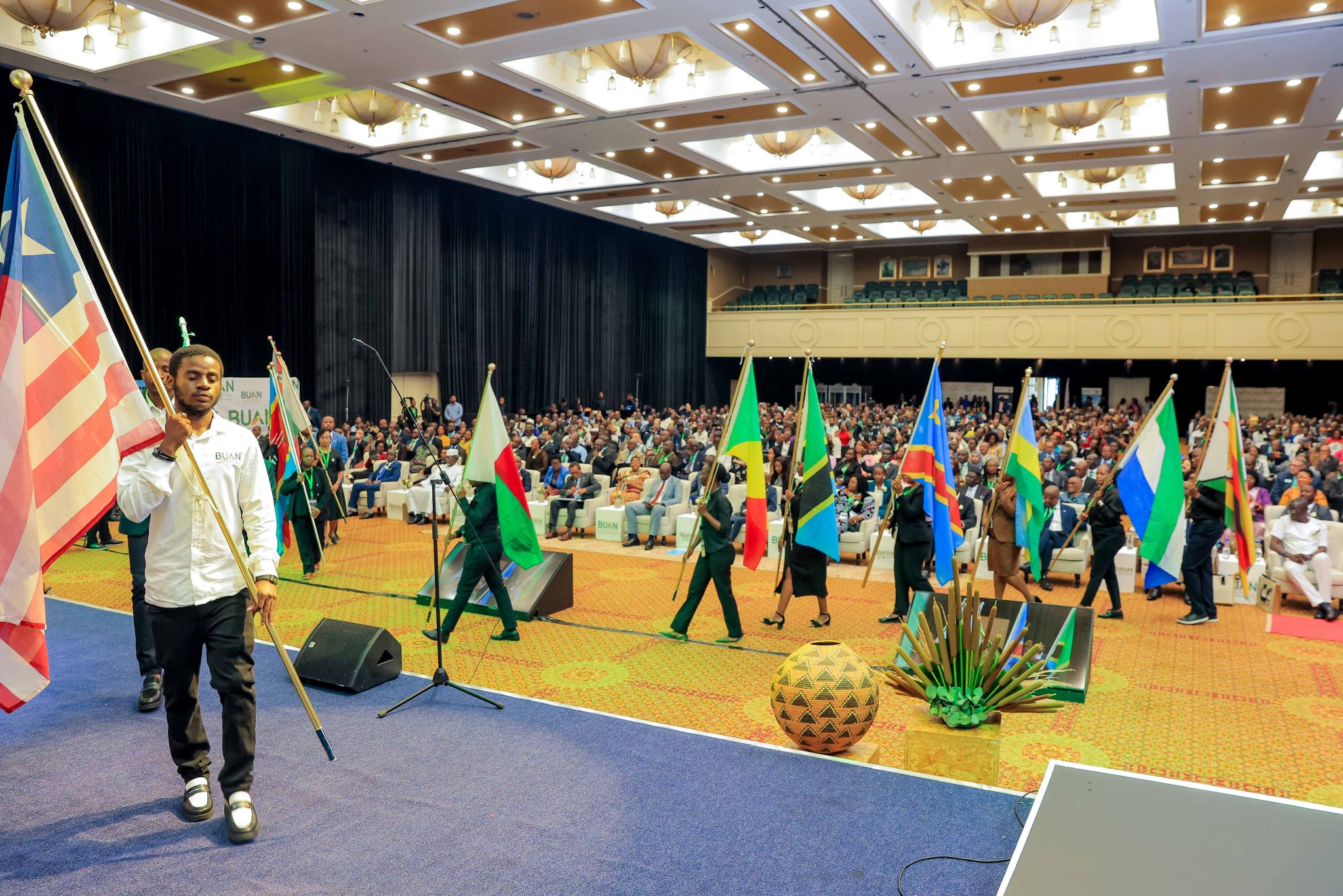 Flags of participating nations are carried through the conference room. Government of Botswana, the host of the Regional Universities Forum for Capacity Building in Agriculture (RUFORUM)’s 21st Annual General Meeting (AGM).