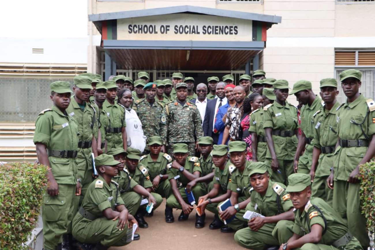 A section of the officer in a group photo at the entrance of the School of Social Sciences, Makerere University. More than 130 cadet officers from Uganda Military Academy (UMA) in Kasambya orientation on library use and access to electronic resources as part of preparations for the Bachelor’s Degree in Defence Studies, 20th November 2025, College of Humanities and Social Sciences (CHUSS), Makerere University, Kampala Uganda, East Africa.