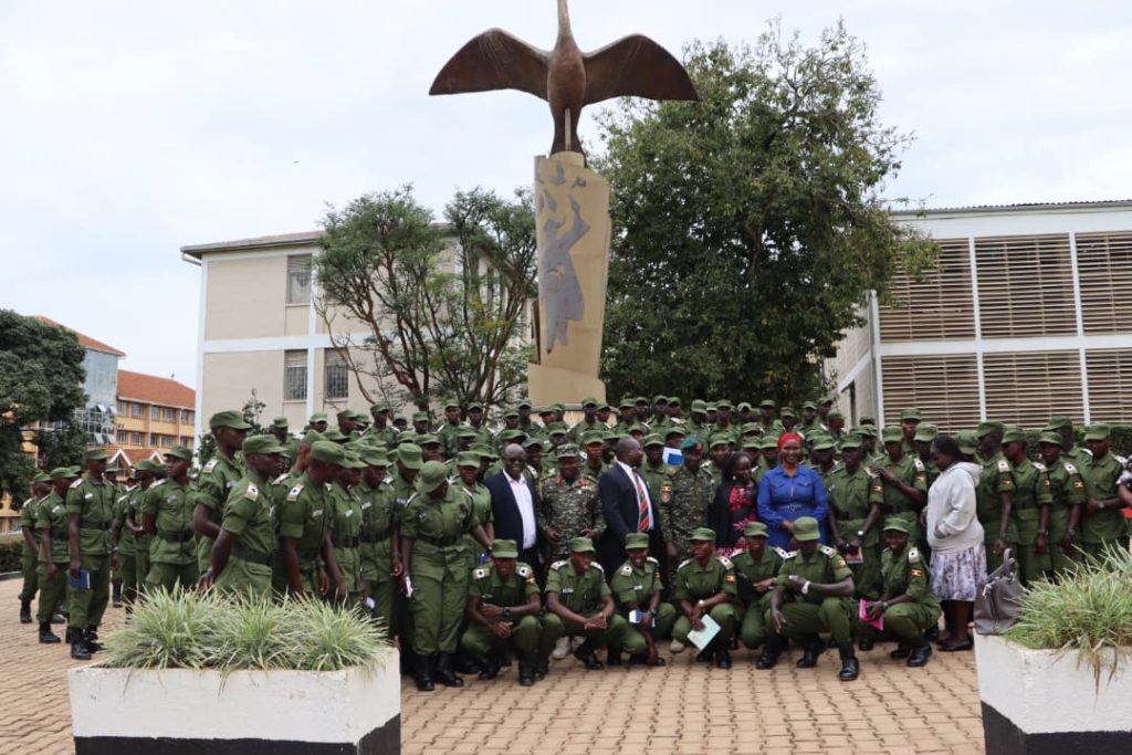 The officers pose for a group photo at the Mak@100 monument. More than 130 cadet officers from Uganda Military Academy (UMA) in Kasambya orientation on library use and access to electronic resources as part of preparations for the Bachelor’s Degree in Defence Studies, 20th November 2025, College of Humanities and Social Sciences (CHUSS), Makerere University, Kampala Uganda, East Africa.