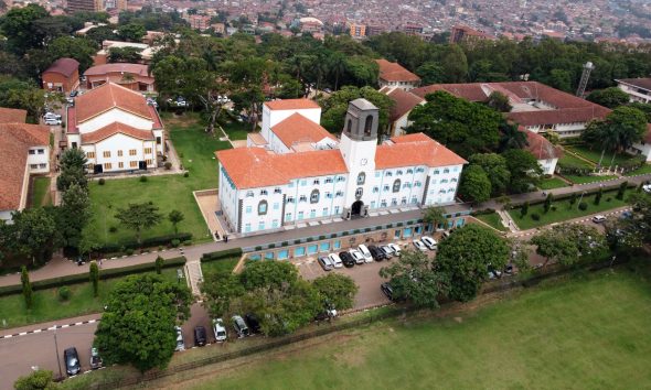 An aerial shot of the Main Building, as taken by a drone over the Freedom Square with Left to Right: CHUSS, St. Francis, St. Augustine and CAES Buildings and the Kikoni area (Background) in view. Makerere University, Kampala Uganda, East Africa.