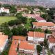 An aerial photo of Clockwise Top Left to Right: St. Francis Chapel, Main Building, CAES, JICA Building, Chemistry Building, Mathematics, School of Statistics, Main Library, Yusuf Lule Central Teaching Facility, CoBAMS, EPRC, IGDS and the Freedom Square. Makerere University, Kampala Uganda, East Africa.