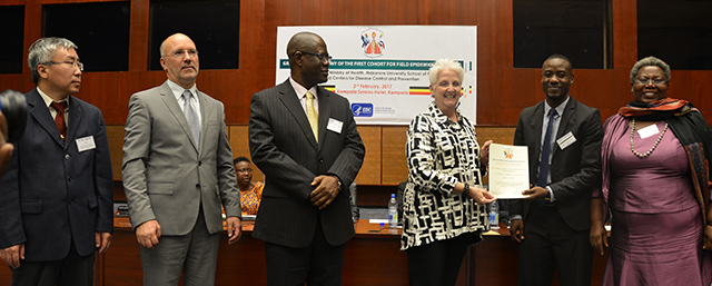 Malac awards exceptional fellow Steven Ndugwa Kabwama on February 2, 2017, at Kampala Serena Hotel; l-r: FETP Resident Advisor Bao Ping Zhu, Steven Wiersma, WHO Representative Mazila, and his host mentor Sheila Ndyanabangyi.