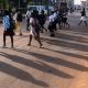 Pedestrians on high alert as they cross the road in Kampala City.