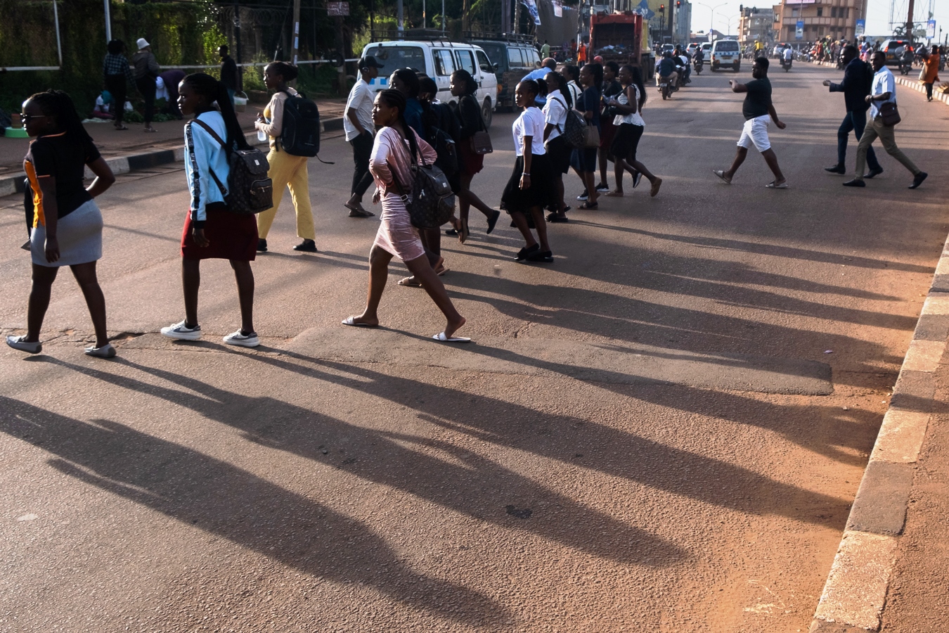 Pedestrians on high alert as they cross the road in Kampala City. Photo by Katumba Badru