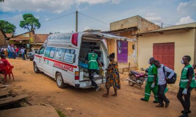 An emergency response team extracts a suspected case from the community during the pandemic.