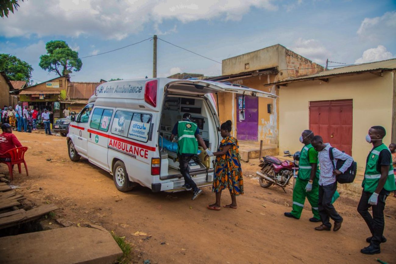 An emergency response team extracts a suspected case from the community during the pandemic.