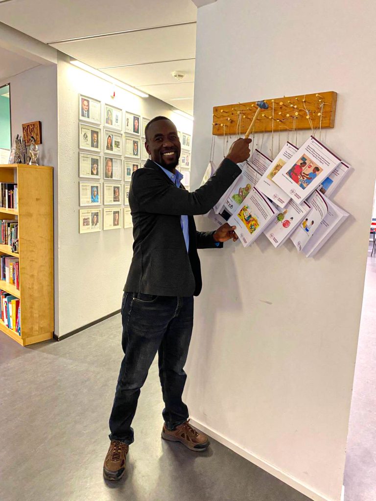 Kabwama nails his thesis on the wall at KI.