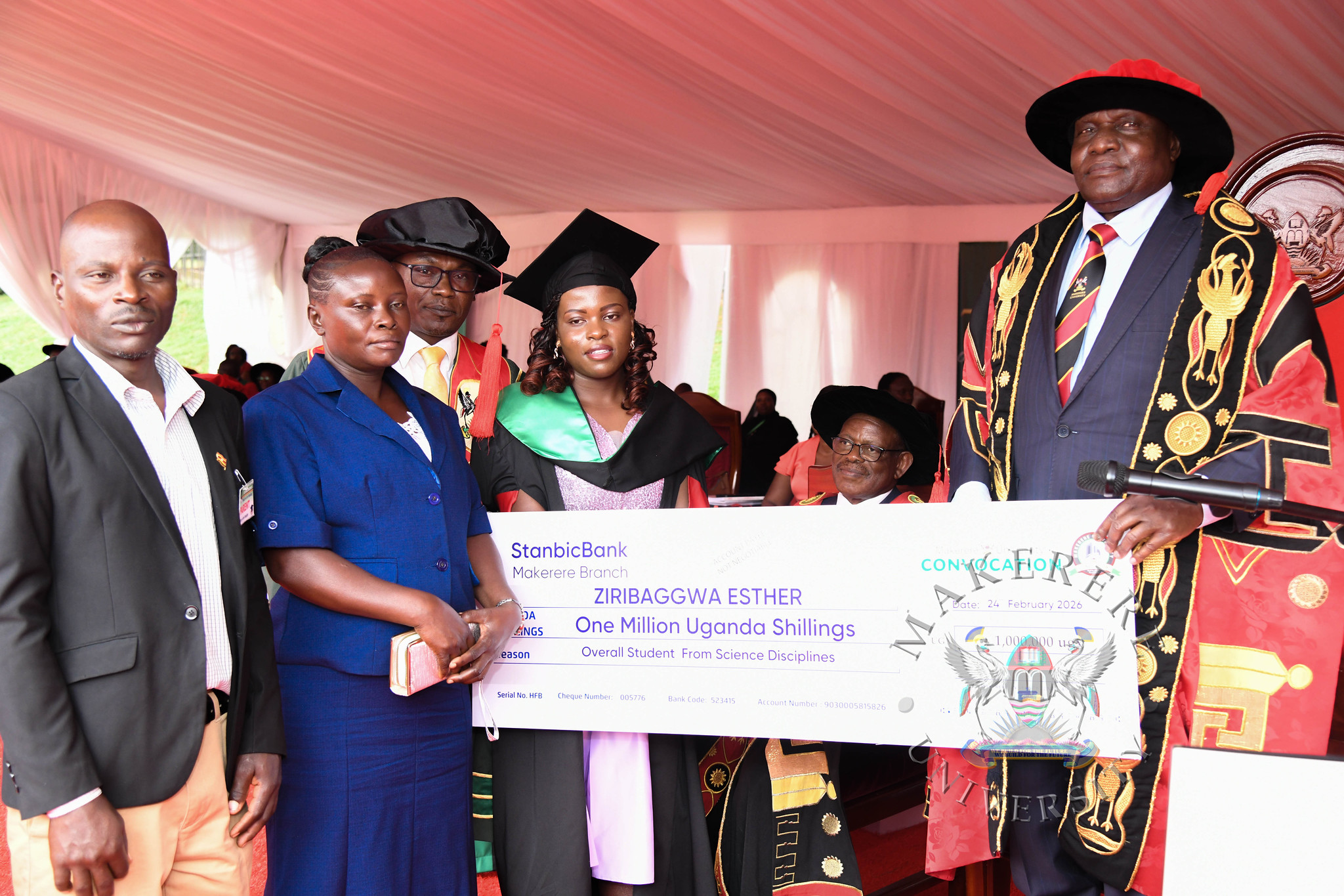 Best Overall Student in the Sciences-Esther Ziribaggwa accompanied by her parents and the Chairperson Convocation-Mr. George Turyamureeba receives a cheque from the Chancellor. 76th Graduation Ceremony, Day 1, CAES, CoCIS, CEES and School of Law. Commencement Speaker-Prof. Nicholas Ozor, the Executive Director of the African Technology Policy Studies Network, Nairobi, Kenya. 24th February 202, Freedom Square, Makerere University, Kampala Uganda, East Africa.