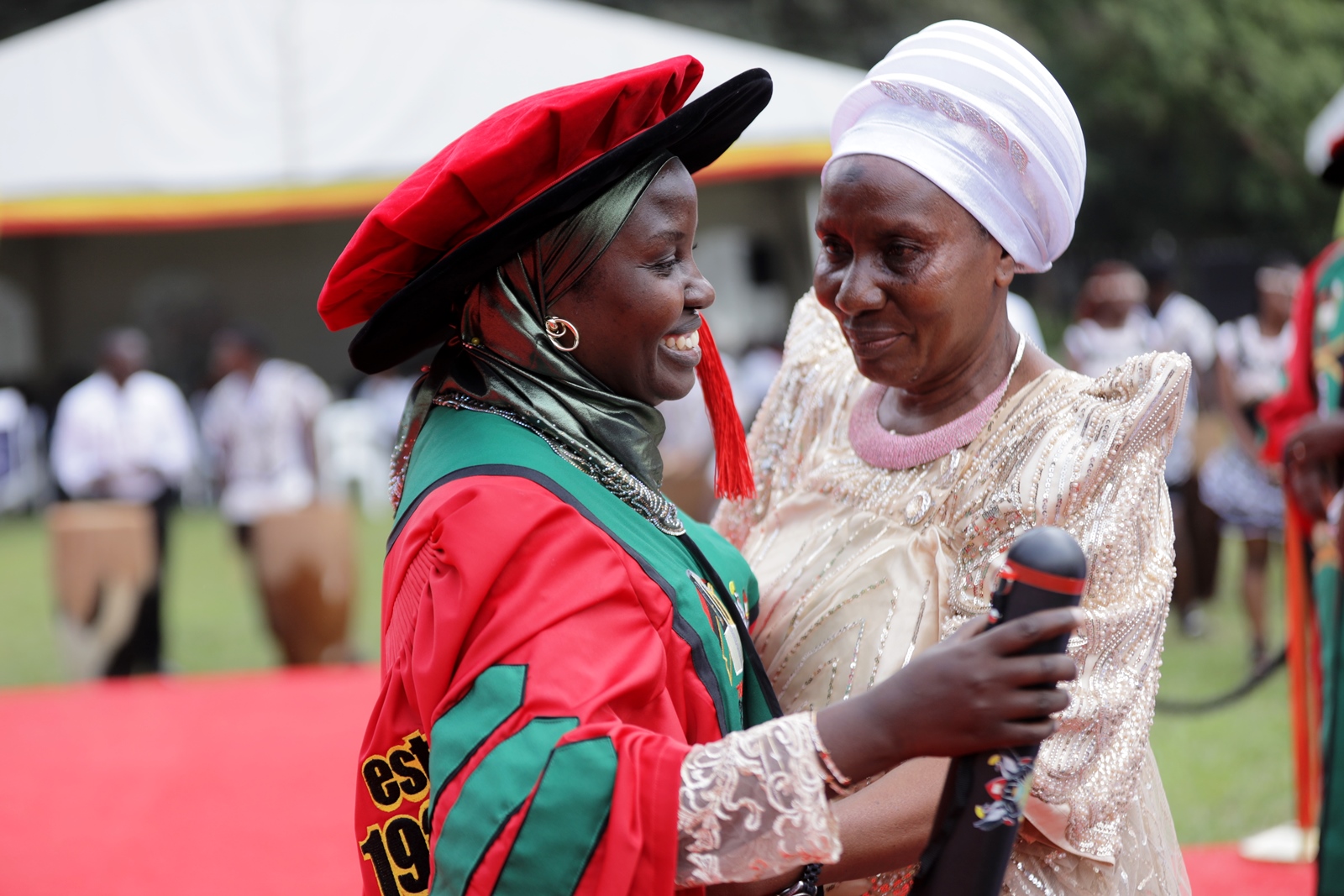 Dr Zaina Nampijja being congratulated by her mother. 76th Graduation Ceremony, Day 1, College of Agricultural and Environmental Sciences (CAES). Commencement Speaker-Prof. Nicholas Ozor, the Executive Director of the African Technology Policy Studies Network, Nairobi, Kenya. 24th February 202, Freedom Square, Makerere University, Kampala Uganda, East Africa.