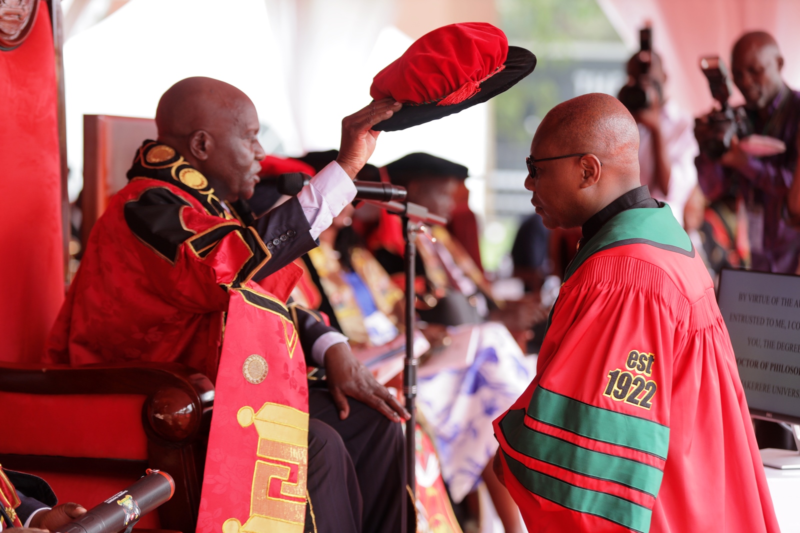 The Chancellor conferring a PhD on to one of the CAES graduates. 76th Graduation Ceremony, Day 1, College of Agricultural and Environmental Sciences (CAES). Commencement Speaker-Prof. Nicholas Ozor, the Executive Director of the African Technology Policy Studies Network, Nairobi, Kenya. 24th February 202, Freedom Square, Makerere University, Kampala Uganda, East Africa.