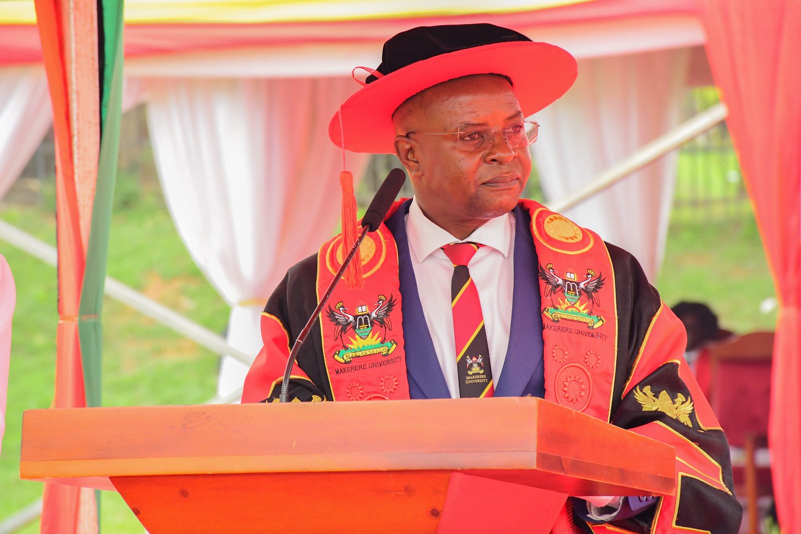 The Principal of CoBAMS, Prof. Edward Bbaale reading the names of PhD Graduands at the 76th Graduation Ceremony. 76th Graduation Ceremony, Day 3, College of Business and Management Sciences (CoBAMS). Commencement Speaker-Dr. Patricia Adongo Ojangole, Managing Director, Uganda Development Bank Limited. 26th February 2026, Freedom Square, Makerere University, Kampala Uganda, East Africa.