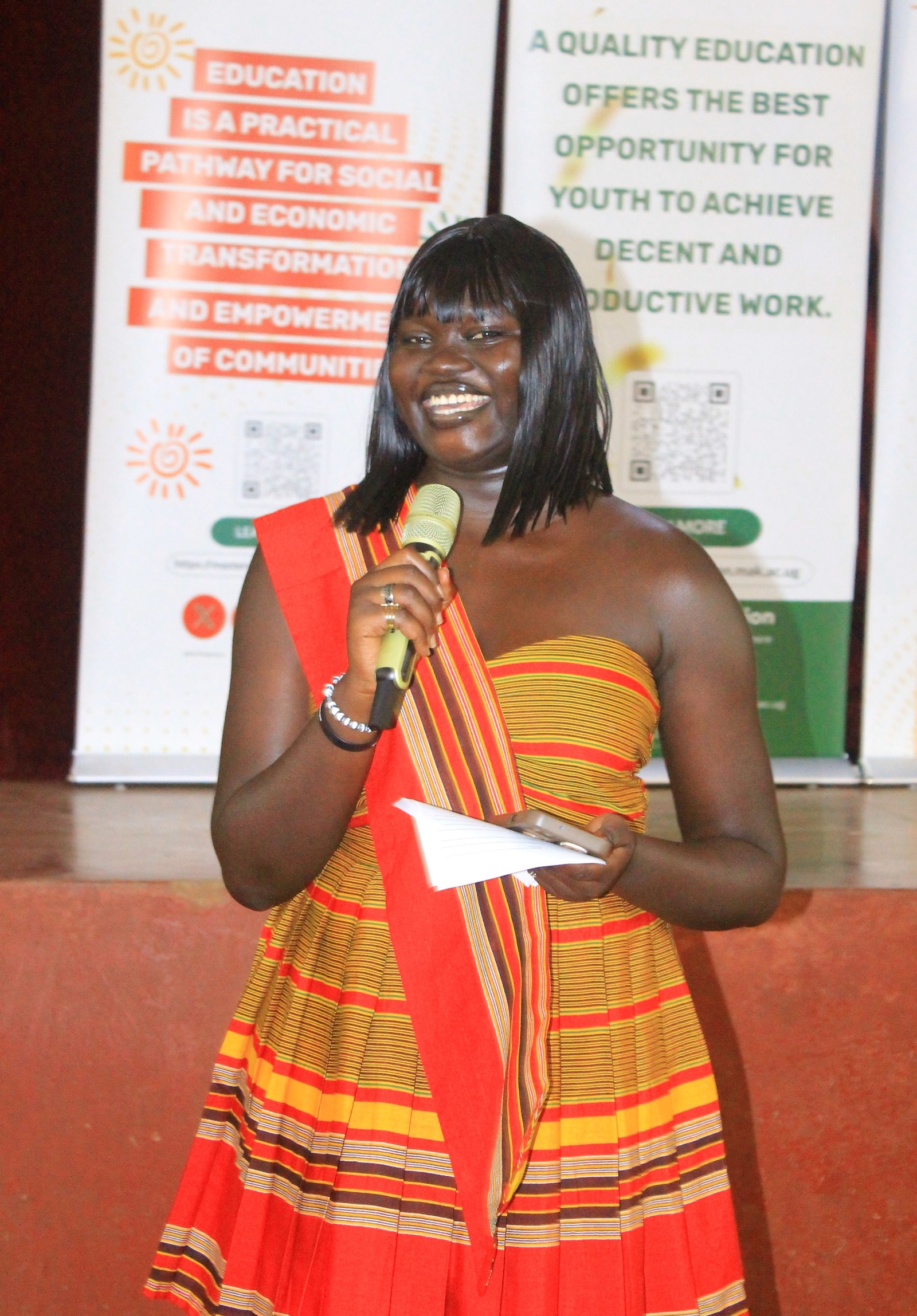 The event Emcee clad in her traditional African wear. Mastercard Foundation Scholars Program at Makerere University annual cultural dinner to reconnect the Scholars community, share key Program updates, and create an inclusive space to strengthen belonging and engagement, 13th February 2026, Kampala Uganda, East Africa.