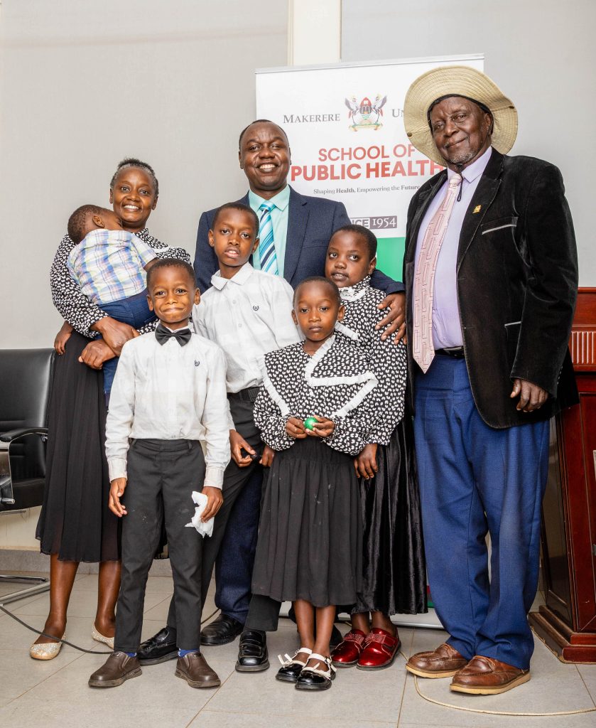 Moses Ntaro, his wife Judith Owokuhaisa Ntaro (JON), his father and former Kabale LCV Chairperson Yosam Baguma, and children Happy, Joshua, Samuel, Esther, and Deborah, shortly after the PhD defence. Makerere University School of Public Health Communications Office, Graduation Profiles Series, 76th Graduation Ceremony, Moses Ntaro, “Effect of Student Community Engagement on Open Defecation-Free Status,” Kampala Uganda, East Africa.