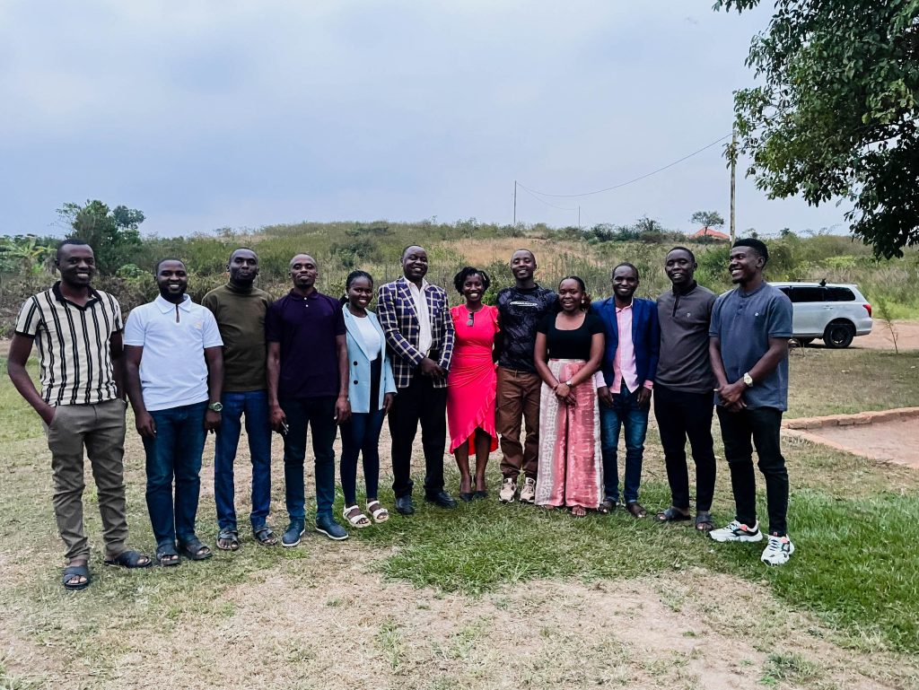 Students who participated in the intervention reunite with Dr. Moses Ntaro (in a checked blazer) four years later, reflecting sustained engagement beyond the project period. Makerere University School of Public Health Communications Office, Graduation Profiles Series, 76th Graduation Ceremony, Moses Ntaro, “Effect of Student Community Engagement on Open Defecation-Free Status,” Kampala Uganda, East Africa.