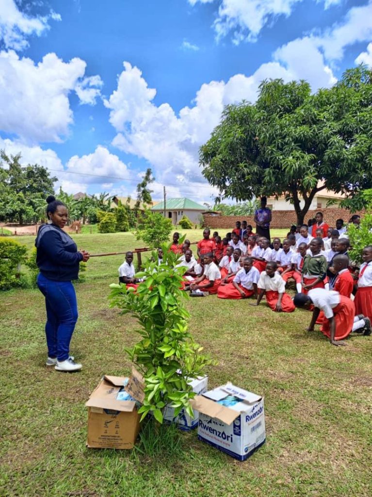 Dr. Nakisita during a School outreach initiative, distributing free NAYO reusable pads to learners at Kiwenda New Primary School, Busukuma Division, Nansana Municipality, Wakiso District. Makerere University School of Public Health Communications Office, Graduation Profiles Series, 76th Graduation Ceremony, Olivia Nakisita, āMaternal Health Services for Adolescent Refugees in Urban Settings in Uganda: Access, Utilisation, and Health Facility Readiness,ā Kampala Uganda, East Africa.