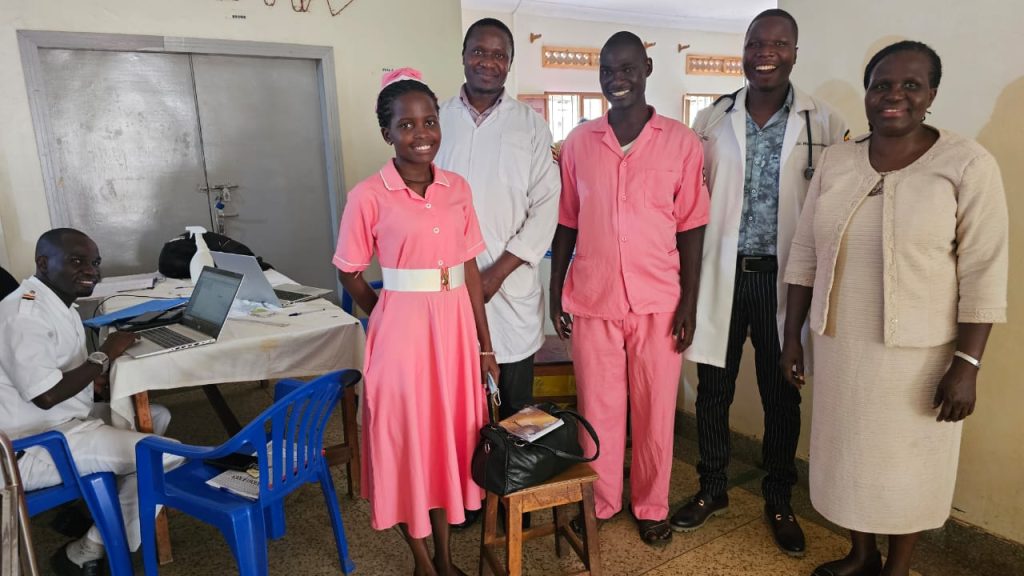 Dr. Namukose (R) with health workers in one of the facilities.