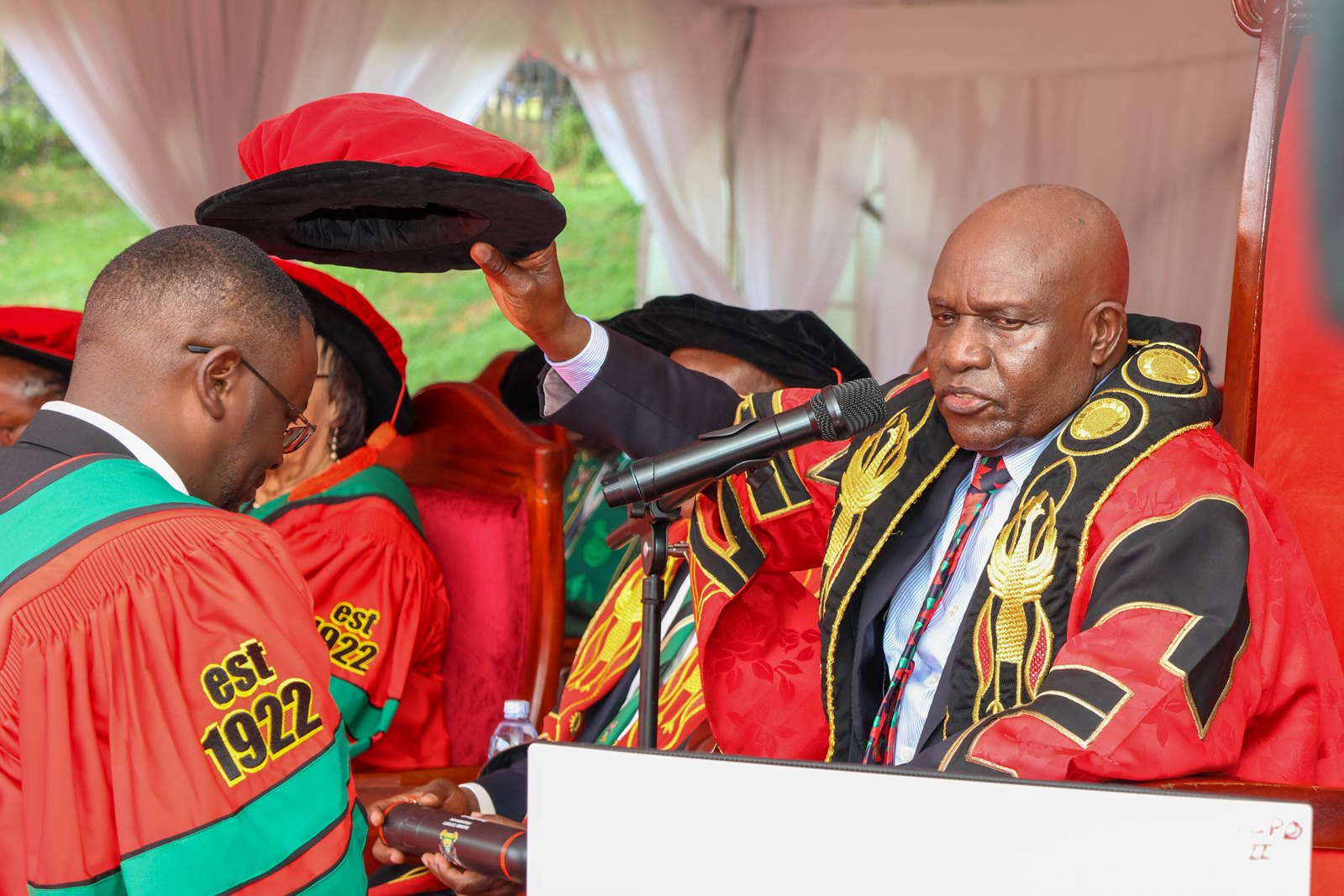 University Chancellor Dr. Crispus Kiyonga confers a Doctorate Degree upon one of the graduands last week. 76th Graduation Ceremony, Day 2, School of Public Health (MakSPH). Commencement Speaker-Dr. Margaret J. Kigozi, Makerere University Endowment Fund Chairperson. 25th February 2026, Freedom Square, Kampala Uganda, East Africa.