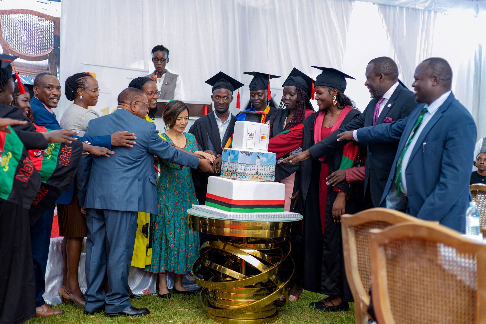 Ms. Reeta Roy, alongside University Officials cuts cake with Mastercard Foundation Scholars who graduated during the 76th Graduation Ceremony. Celebrating 13 years of a significant partnership with the Mastercard Foundation and honorary Doctor of Laws conferred upon Ms. Reeta Roy, the Founding President and CEO of the Mastercard Foundation, 27th February 2026, Makerere University, Kampala Uganda, East Africa.