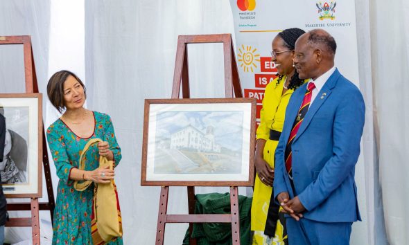 Ms. Reeta Roy, receiving some memorabilia from Dr. Lorna Magara and Prof. Barnabas Nawangwe during the event. Celebrating 13 years of a significant partnership with the Mastercard Foundation and honorary Doctor of Laws conferred upon Ms. Reeta Roy, the Founding President and CEO of the Mastercard Foundation, 27th February 2026, Makerere University, Kampala Uganda, East Africa.