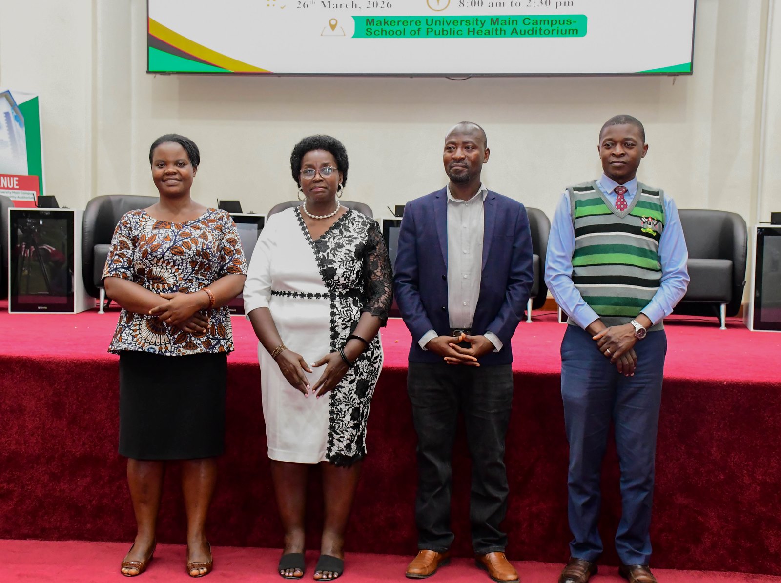 L-R: Dr. Naomi Namanya, Dr. Anne Ampaire, Dr. Martin Baluku, Dr. Richard Balikoowa being introduced to the participants. School Stakeholders’ Exhibition, bringing together learners, teachers, researchers, and education policymakers to demonstrate how Uganda’s Competence Based Curriculum (CBC) can be implemented through experiential learning and real-life situations, by graduate students of College of Education and External Studies (CEES) and College of Humanities and Social Sciences (CHUSS) guided by Dr. Anne Ampaire, 26th March 2026, Makerere University School of Public Health Auditorium, Kampala Uganda, East Africa.