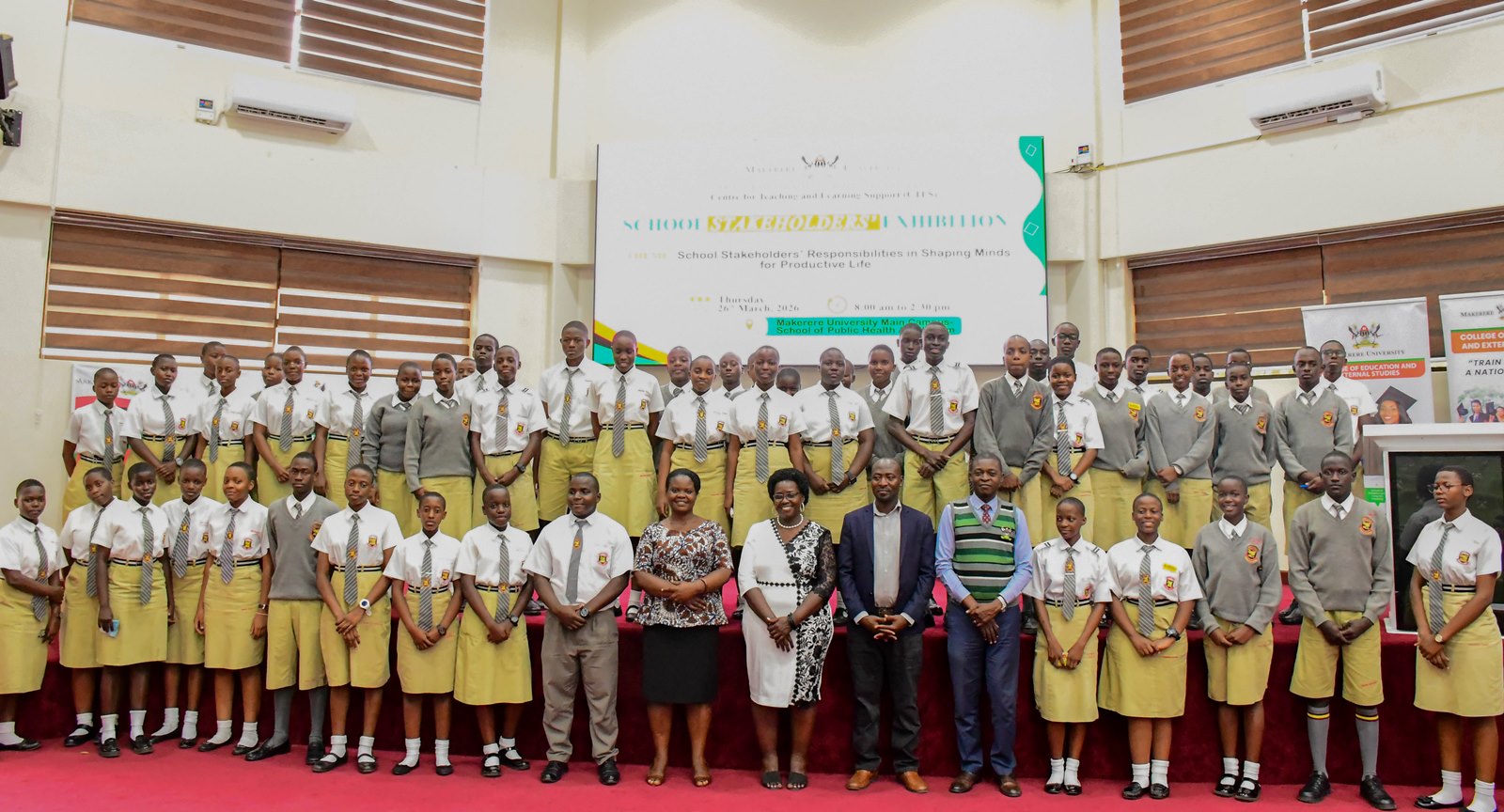 Mengo S.S.S students pose for a commemorative photo. School Stakeholders’ Exhibition, bringing together learners, teachers, researchers, and education policymakers to demonstrate how Uganda’s Competence Based Curriculum (CBC) can be implemented through experiential learning and real-life situations, by graduate students of College of Education and External Studies (CEES) and College of Humanities and Social Sciences (CHUSS) guided by Dr. Anne Ampaire, 26th March 2026, Makerere University School of Public Health Auditorium, Kampala Uganda, East Africa.