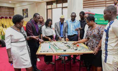 Dr. Anne Ampaire demonstrates the sand strategy model as a CBC approach detailing the map of Makerere University, access points and key features during the event on 26th March 2026. School Stakeholders’ Exhibition, bringing together learners, teachers, researchers, and education policymakers to demonstrate how Uganda’s Competence Based Curriculum (CBC) can be implemented through experiential learning and real-life situations, by graduate students of College of Education and External Studies (CEES) and College of Humanities and Social Sciences (CHUSS) guided by Dr. Anne Ampaire, 26th March 2026, Makerere University School of Public Health Auditorium, Kampala Uganda, East Africa.