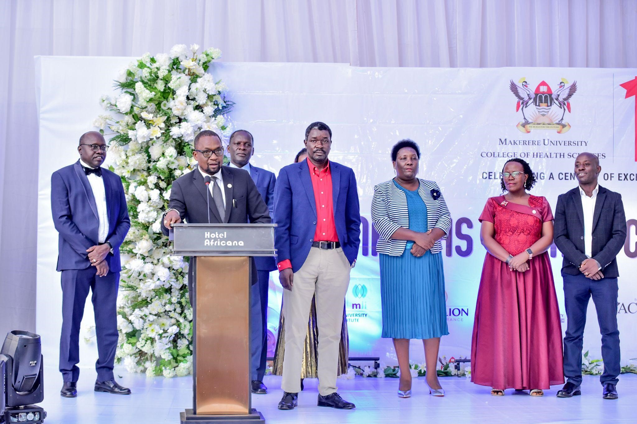 A photo moment of the College administration addressing the alumni at the dinner. Makerere University College of Health Sciences celebrates 100 years of training health professionals, 6th March 2026, Nile Hall, Hotel Africana, Kampala Uganda, East Africa.