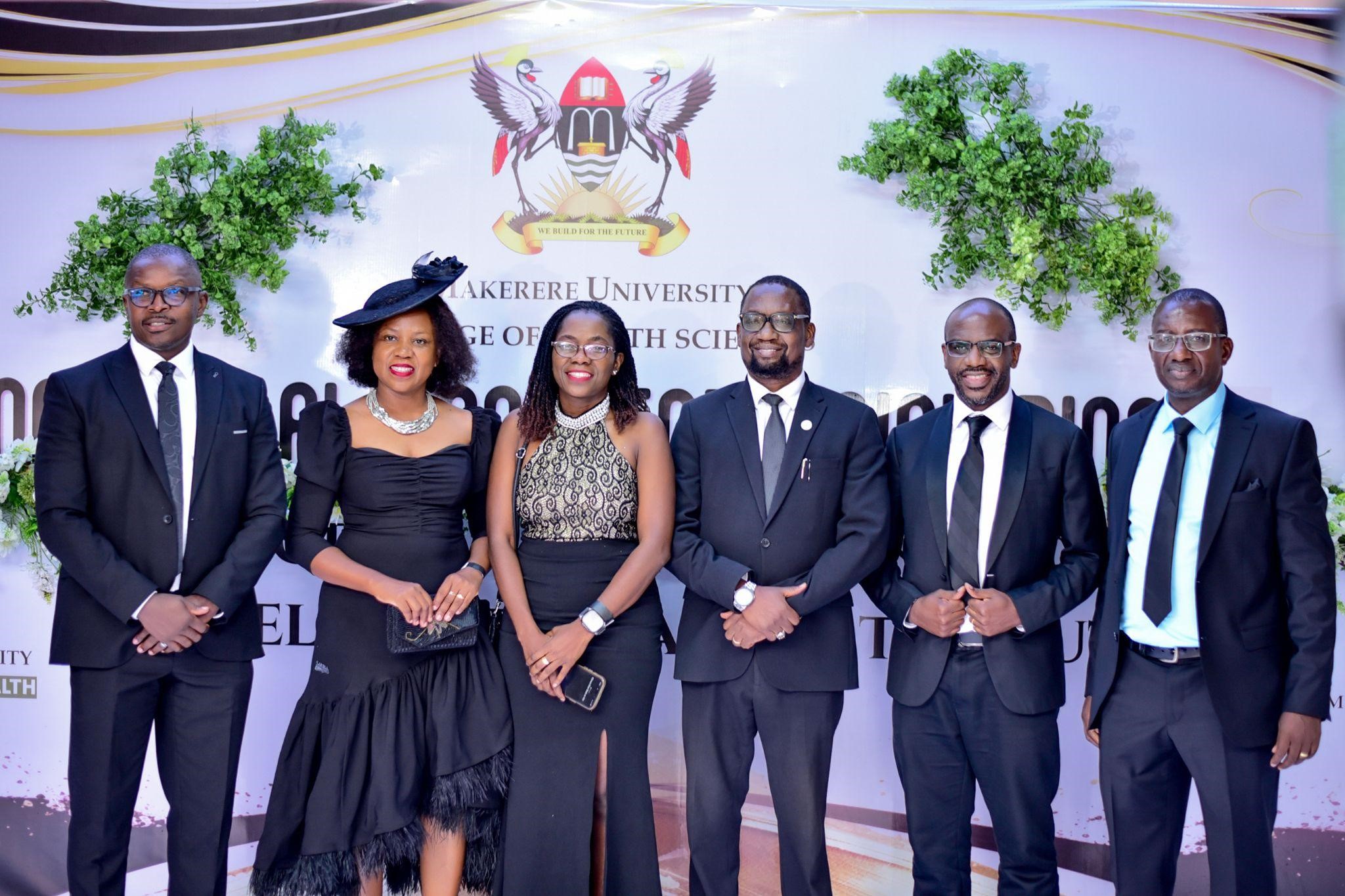 A red-carpet photo moment of CHS alumni at the dinner. Makerere University College of Health Sciences celebrates 100 years of training health professionals, 6th March 2026, Nile Hall, Hotel Africana, Kampala Uganda, East Africa.