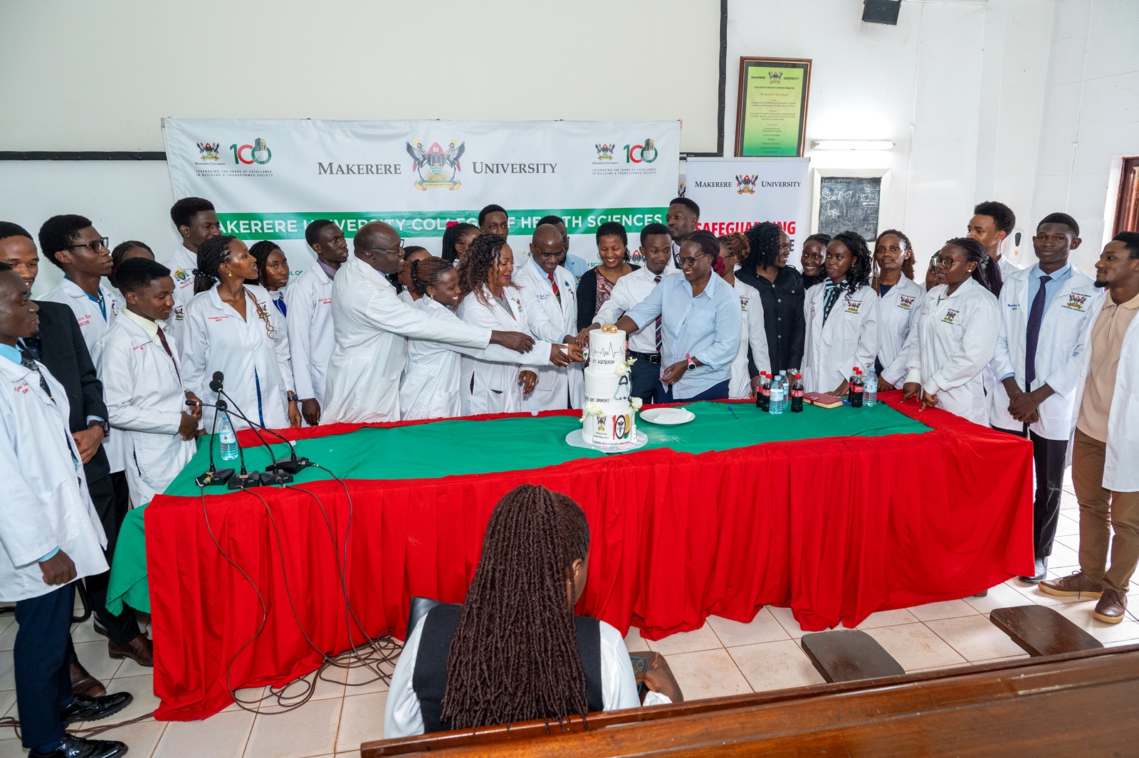 Cake cutting, one of the White Coat Ceremony highlights. White Coat Ceremony for Medical students, 12th March 2026, College of Health Sciences, Mulago Campus, Makerere University, Kampala Uganda, East Africa.