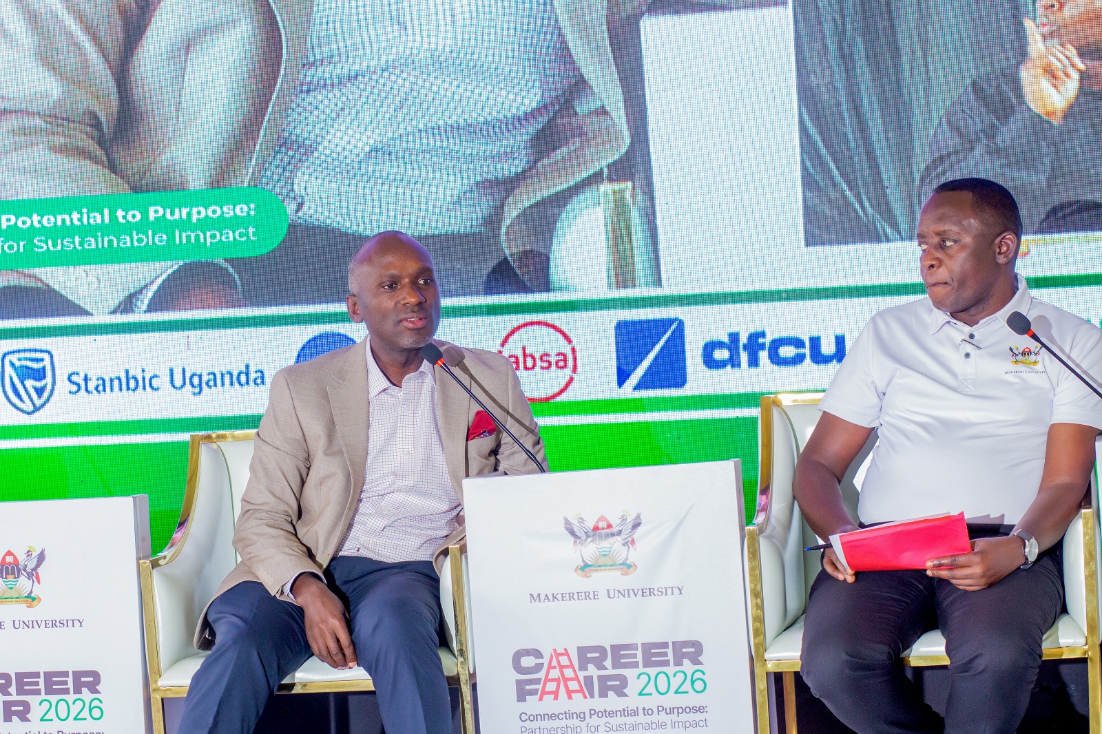 Israel Arinaitwe (L) with Moderator of the panel discussion Henry Nsubuga (R). Three-day Careers Fair 2026, bringing together students, industry leaders, and policymakers to discuss the future of work in the era of Artificial Intelligence (AI), Day 3, Grand Finale, held under the theme “Connecting Potential to Purpose: Partnerships for Sustainable Impact”, 13th March 2026, Freedom Square, Makerere University, Kampala Uganda, East Africa.