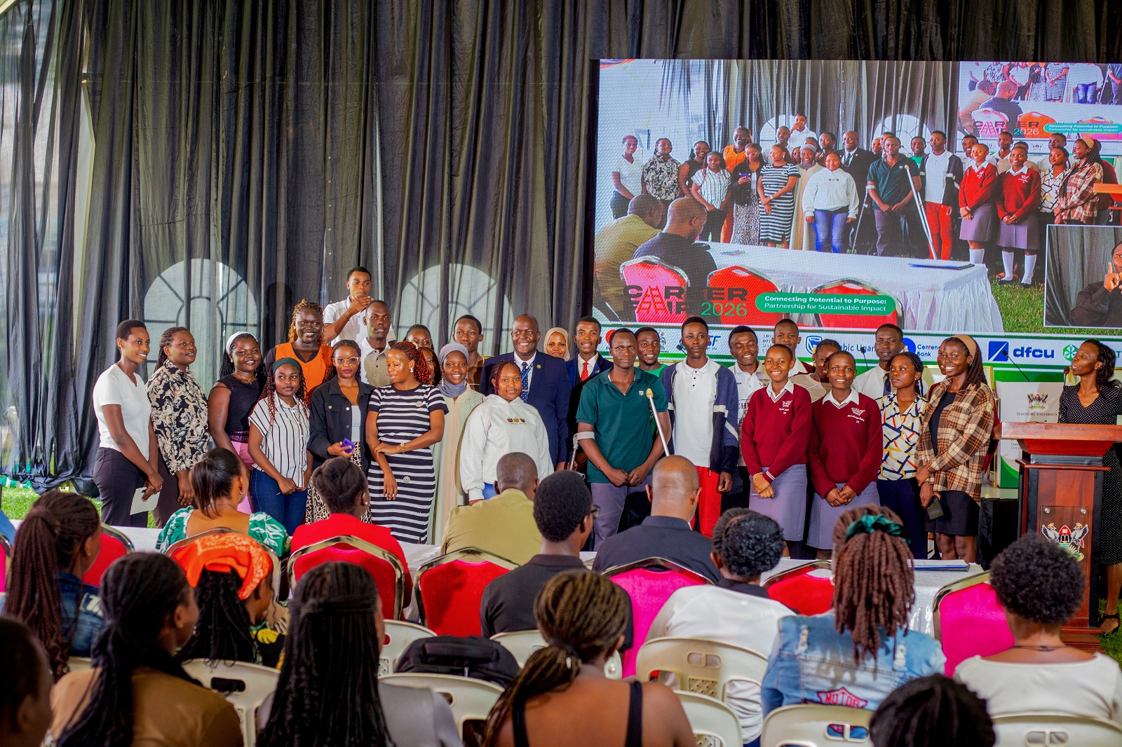 Paul Rumanda Rugambwa enjoys a photo opportunity with participants after his keynote address on Day 3 of the Careers Fair. Three-day Careers Fair 2026, bringing together students, industry leaders, and policymakers to discuss the future of work in the era of Artificial Intelligence (AI), Day 3, Grand Finale, held under the theme “Connecting Potential to Purpose: Partnerships for Sustainable Impact”, 13th March 2026, Freedom Square, Makerere University, Kampala Uganda, East Africa.