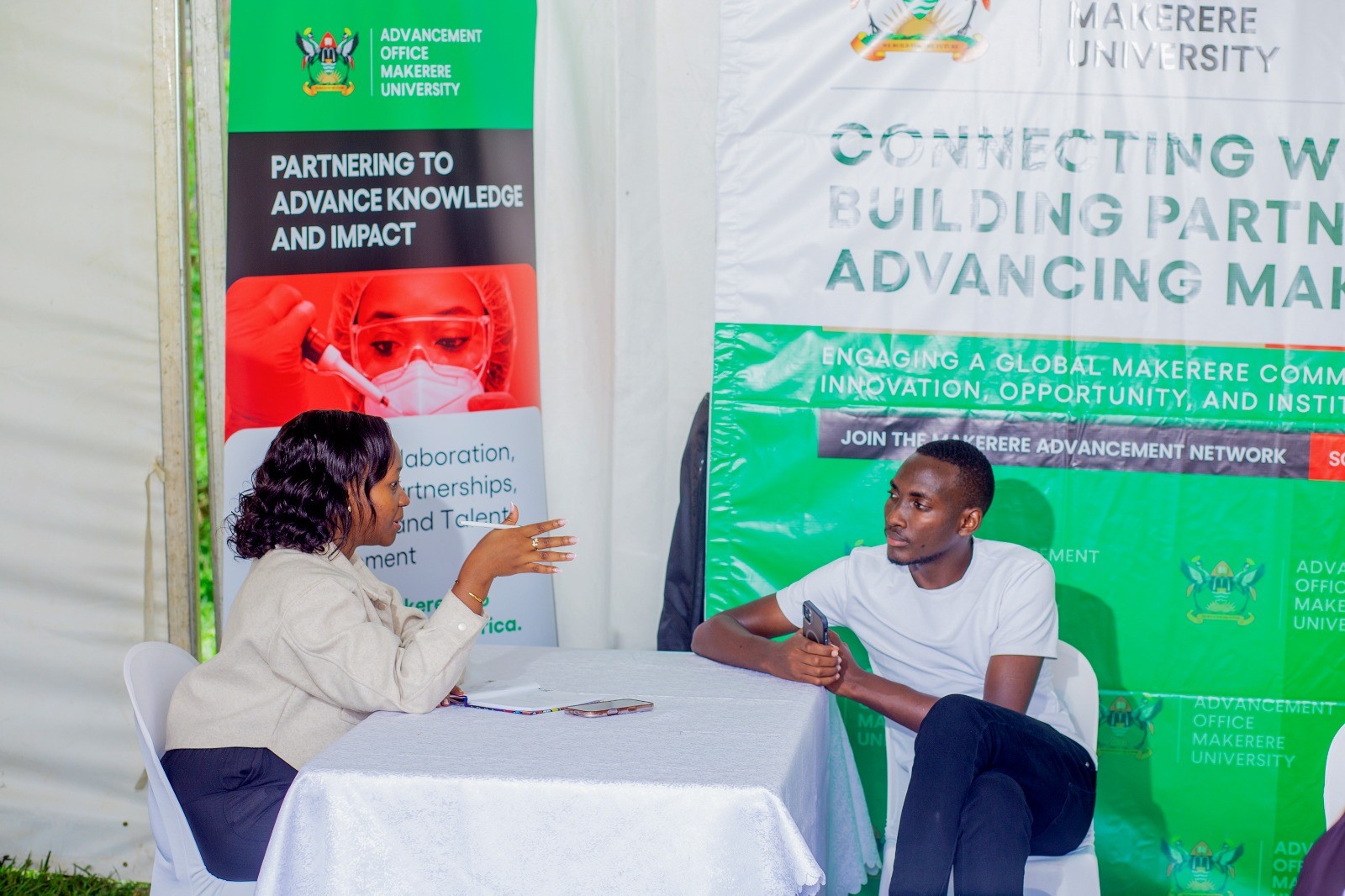 Ms. Caroline Kainomugisha engaging a student from the careers fair. Three-day Careers Fair 2026, bringing together students, industry leaders, and policymakers to discuss the future of work in the era of Artificial Intelligence (AI), Day 3, Grand Finale, held under the theme “Connecting Potential to Purpose: Partnerships for Sustainable Impact”, 13th March 2026, Freedom Square, Makerere University, Kampala Uganda, East Africa.