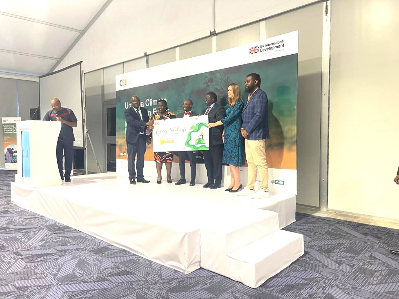 The team led by Dr. Abubakar Sadik Mustafa (3rd L) receiving the award on 26th February 2026. Research team from the Department of Plant Sciences, Microbiology, and Biotechnology, College of Natural Sciences (CONAS), Makerere University led by Dr. Abubakar Sadik Mustafa (Principal Investigator) awarded prestigious Uganda Climate Innovation Fund (UCIF) to support pioneering the development of a plant-based organic fungicide aimed at significantly reducing Aspergillus growth and aflatoxin contamination in maize, 26th February 2026, Kampala Uganda, East Africa.