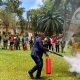 A male participant puts out a fire during a practical demonstrations on the use of fire extinguishers on 26th March 2026. Office of the Dean of Students hands-on training focused on equipping custodians and wardens with essential skills and knowledge on fire prevention, evacuation procedures and response strategies in case of emergencies in halls of residence, March 26, 2026, at University Hall, Makerere University, Kampala Uganda, East Africa.