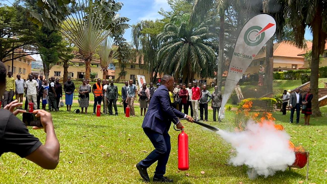A male participant puts out a fire during a practical demonstrations on the use of fire extinguishers on 26th March 2026. Office of the Dean of Students hands-on training focused on equipping custodians and wardens with essential skills and knowledge on fire prevention, evacuation procedures and response strategies in case of emergencies in halls of residence, March 26, 2026, at University Hall, Makerere University, Kampala Uganda, East Africa.