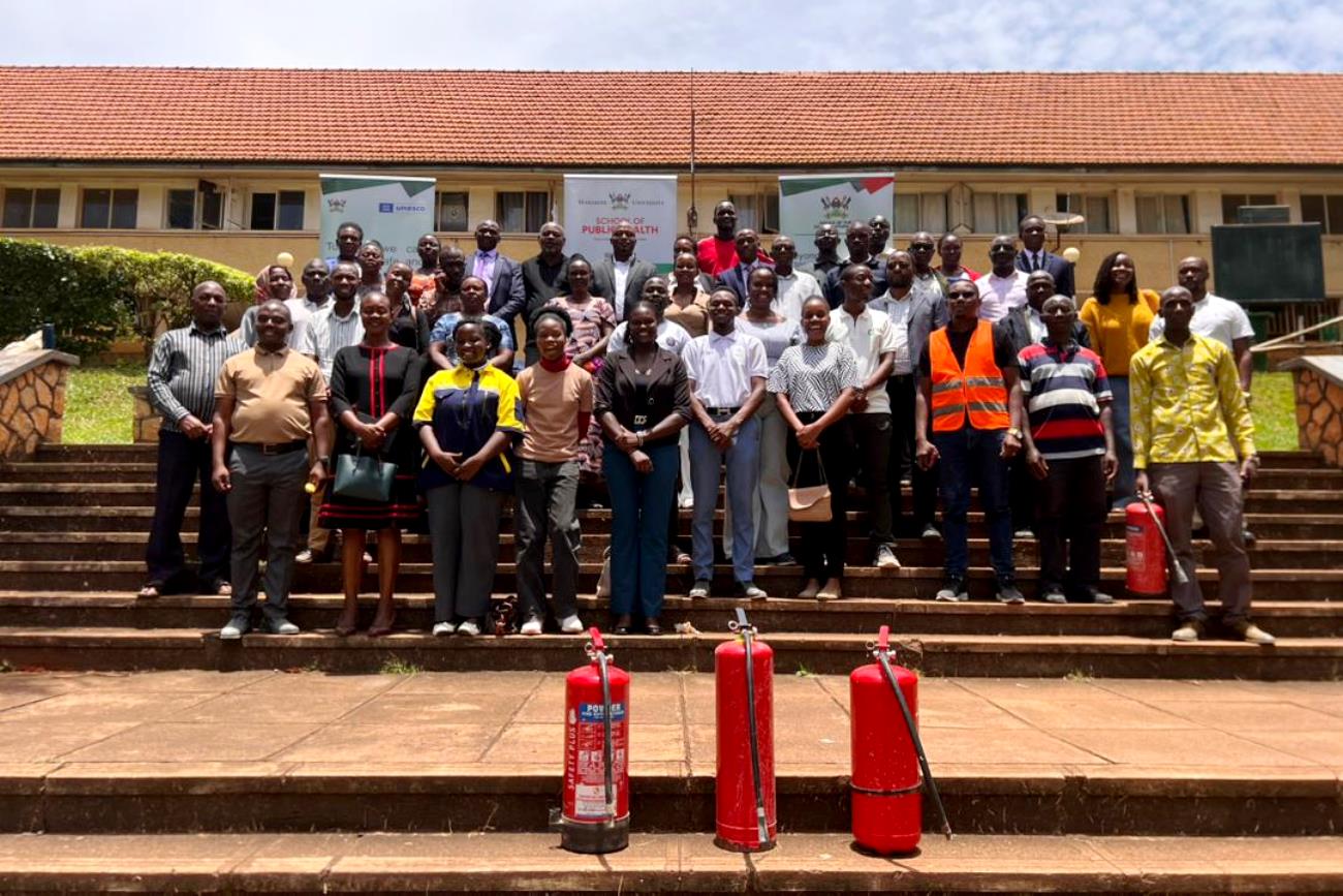Participants pose for a group photo at the University Hall Staircase. Office of the Dean of Students hands-on training focused on equipping custodians and wardens with essential skills and knowledge on fire prevention, evacuation procedures and response strategies in case of emergencies in halls of residence, March 26, 2026, at University Hall, Makerere University, Kampala Uganda, East Africa.