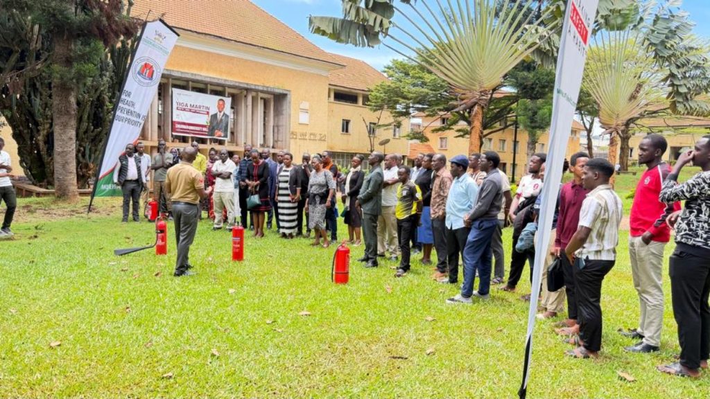 Participants listen to instructions from one of the trainers. Office of the Dean of Students hands-on training focused on equipping custodians and wardens with essential skills and knowledge on fire prevention, evacuation procedures and response strategies in case of emergencies in halls of residence, March 26, 2026, at University Hall, Makerere University, Kampala Uganda, East Africa.