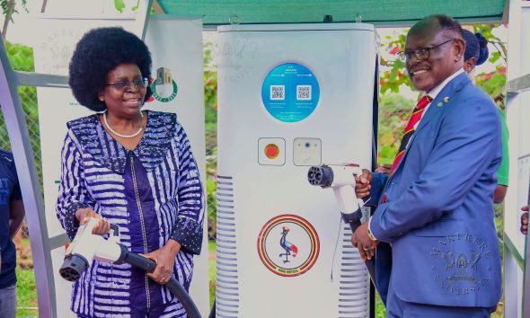 Hon. Dr. Monica Musenero (L) and Prof. Barnabas Nawangwe (R) hold the Electric Fast-Charging Station's cables after the launch on 13th March 2026. Hon. Dr. Monica Musenero commissions first DC Electric C6-180 Fast-Charging Station installed in collaboration with Kiira Motors Corporation (KMC), Senate Building Parking Lot, Makerere University, Kampala Uganda, East Africa on Friday 13th March 2026.