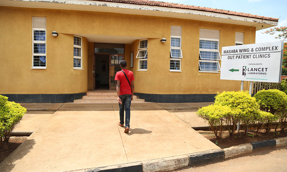 A patient walks into the Masaba Wing outpatient clinics at Mbale Regional Referral Hospital, one of the key study sites for Dr. Harriet Aber’s research on substance use among children in Mbale, Uganda. Photo: Mbale Regional Referral Hospital. Makerere University School of Public Health Communications Office, Graduation Profiles Series, 76th Graduation Ceremony, Dr. Harriet Aber Odonga, “Substance Use among Children in Mbale, Uganda: Health System Landscape and Support Structures,” Kampala Uganda, East Africa."
