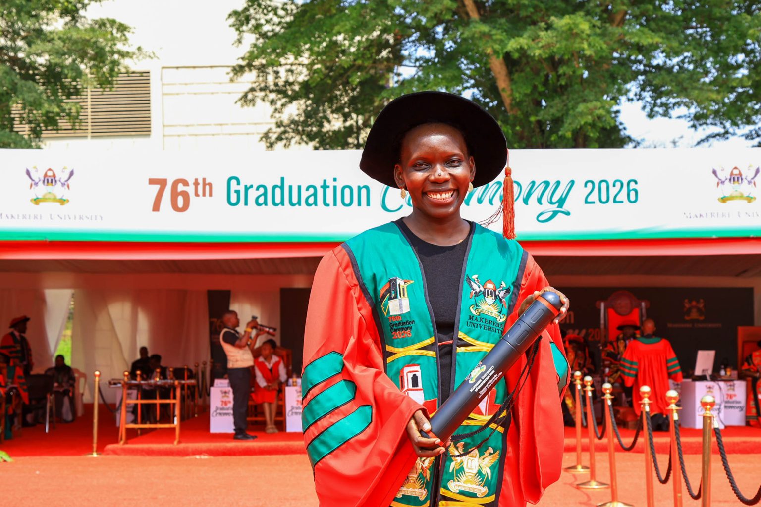 Dr. Harriet Aber moments after being conferred a PhD in Public Health by Chancellor Dr. Crispus Walter Kiyonga during Makerere University’s 76th Graduation Ceremony on February 25, 2026. Makerere University School of Public Health Communications Office, Graduation Profiles Series, 76th Graduation Ceremony, Dr. Harriet Aber Odonga, “Substance Use among Children in Mbale, Uganda: Health System Landscape and Support Structures,” Kampala Uganda, East Africa."