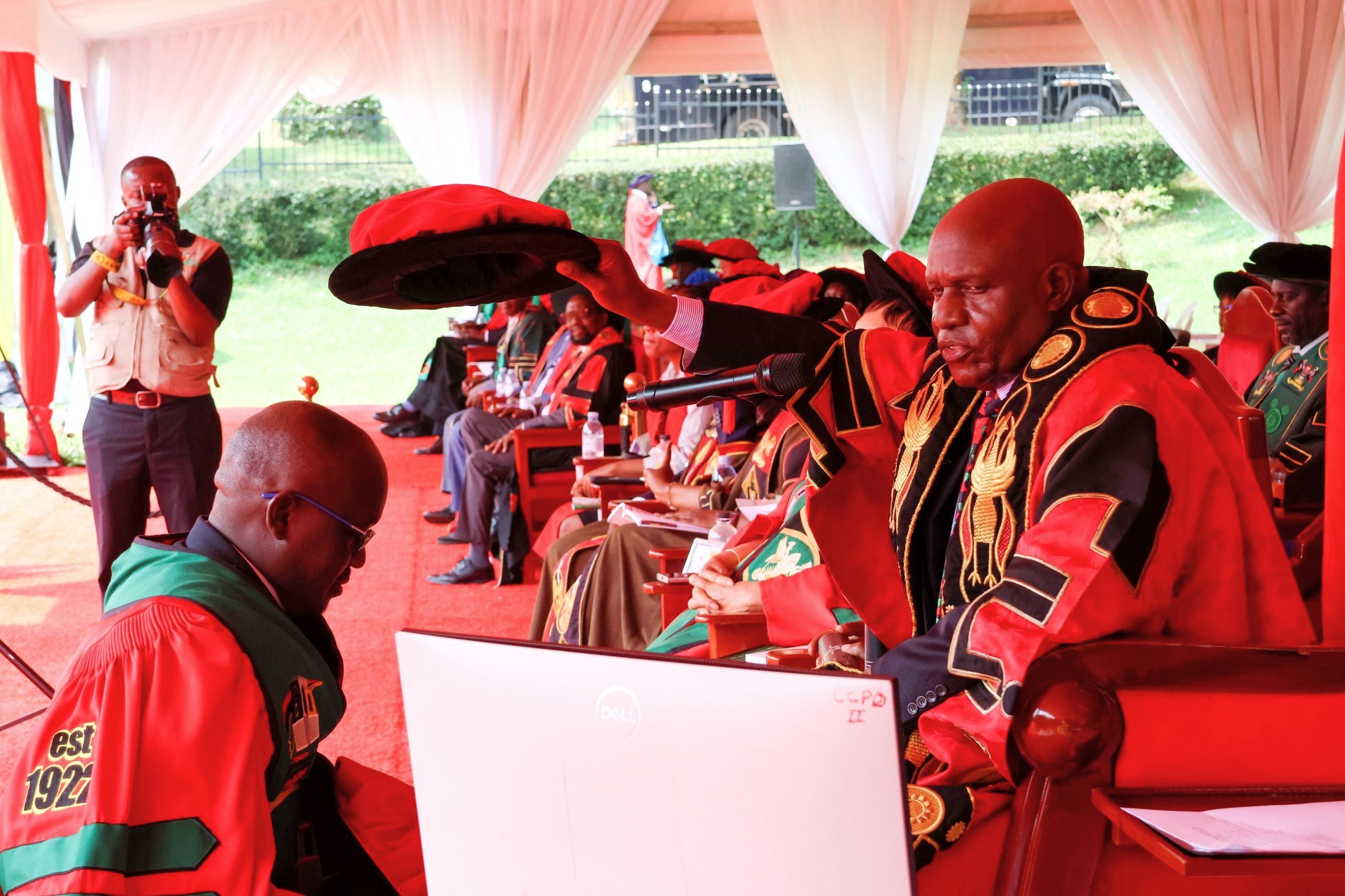 Henry Komakech is conferred upon the Doctor of Philosophy (Public Health) degree by Makerere University Chancellor Dr. Crispus Walter Kiyonga during the 76th Graduation Ceremony on February 25, 2026. His study examined how refugee repatriation reshapes health service delivery and system sustainability in host districts. Makerere University School of Public Health Communications Office, Graduation Profiles Series, 76th Graduation Ceremony, Dr. Henry Komakech, “Effects of the Repatriation of Refugees on the Health Services of the Host Populations in the West Nile Districts of Arua, Moyo, and Adjumani,” Kampala Uganda, East Africa.