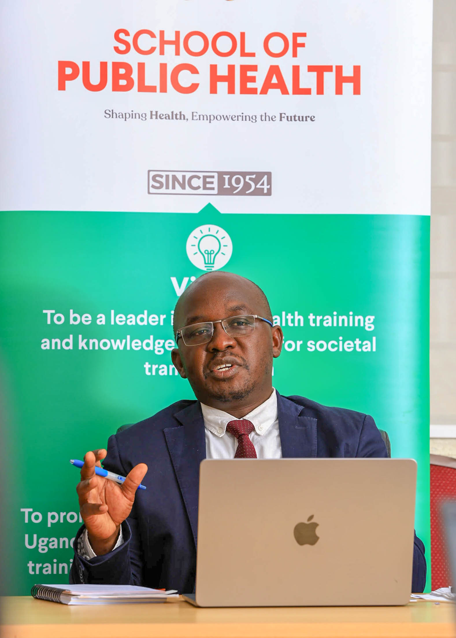 Henry Komakech discusses health system transitions in refugee-hosting districts after repatriation during his doctoral defence on December 19, 2025. Makerere University School of Public Health Communications Office, Graduation Profiles Series, 76th Graduation Ceremony, Dr. Henry Komakech, “Effects of the Repatriation of Refugees on the Health Services of the Host Populations in the West Nile Districts of Arua, Moyo, and Adjumani,” Kampala Uganda, East Africa.